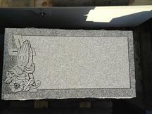 grass marker special in new york catholic cemeteries grey granite with etching and lettering